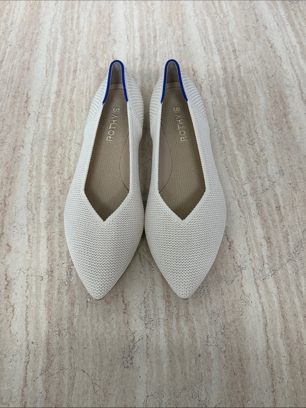 Rothy's Pointed Knit Flats in Cream with Blue Heel Trim